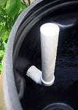 Wide Overflow barrel has internal 90 degree PVC (1-1/2") pipe to channel excess water away.